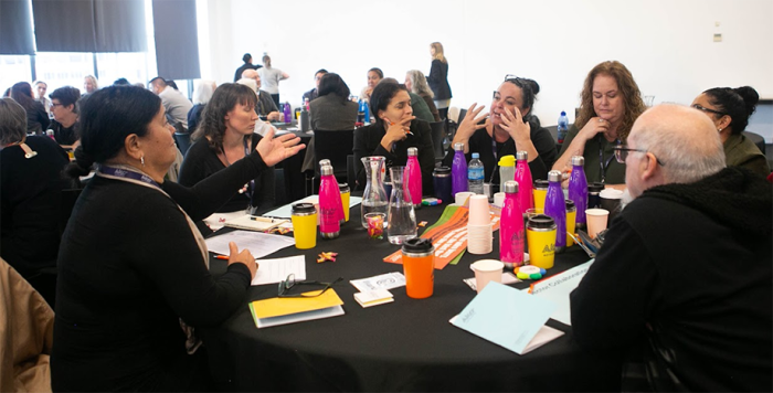 Forum attendees discussing ideas during the kōrerero sessions.