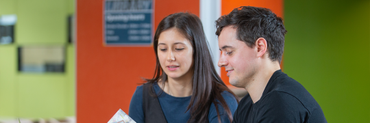 Tertiary students engaged in reading