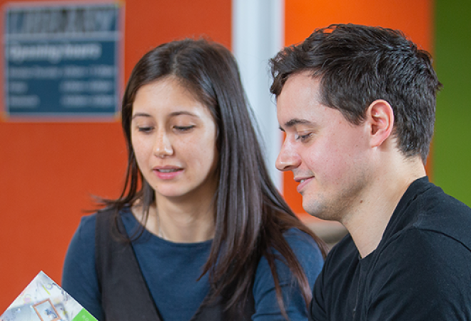 Tertiary students engaged in reading