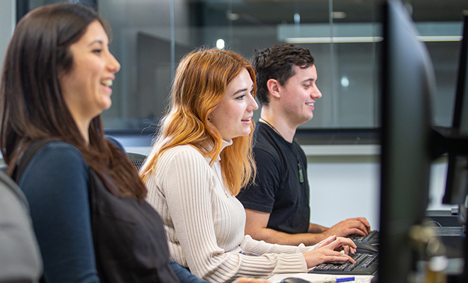Learners work at their computers