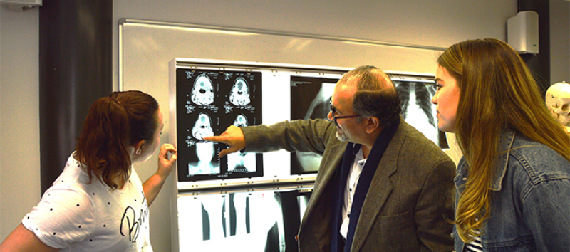 Dr Aziz discussing X-Ray images with students