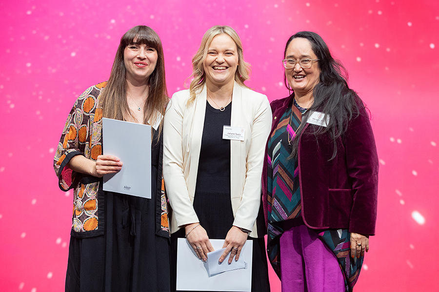 Chloe Humphreys (left) and Juliane Tautz with Ako Aotearoa board co-chair Meegan Hall (right)