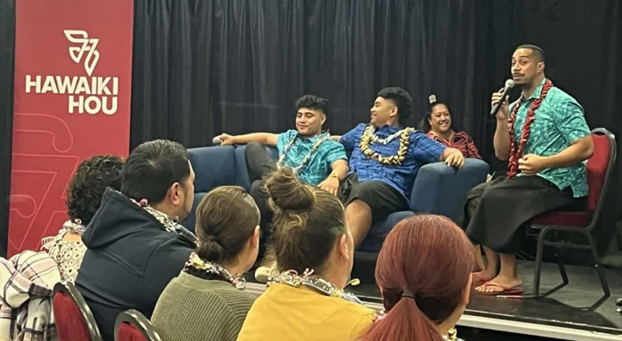 Dion Enari (far right) leads a discussion