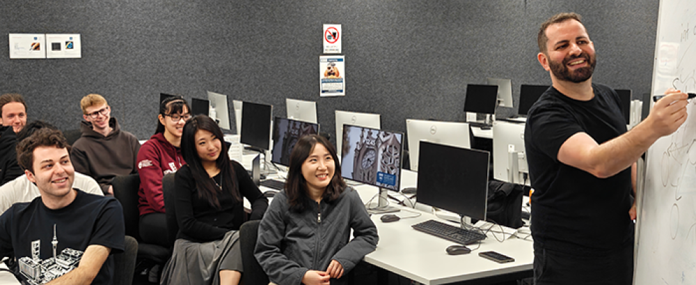 Students look on as Dr Giacaman presents