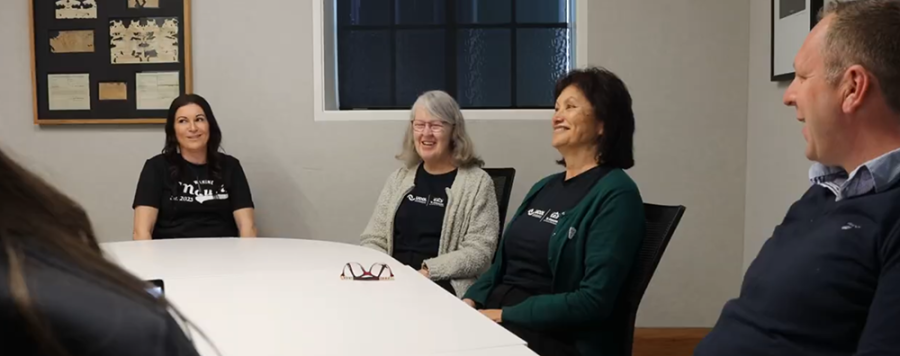 Members of the Te Atakura team having a discussion around a table